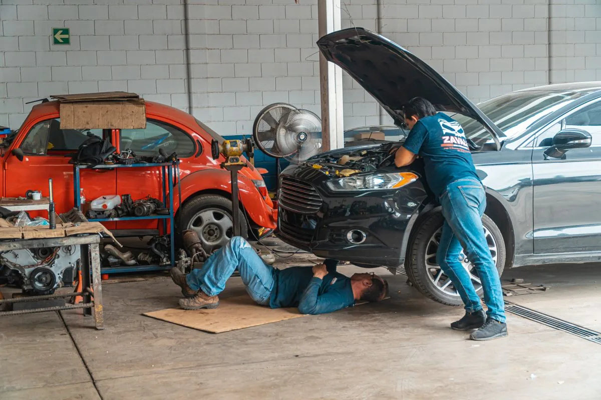 Battery access being checked before a jump-start visit